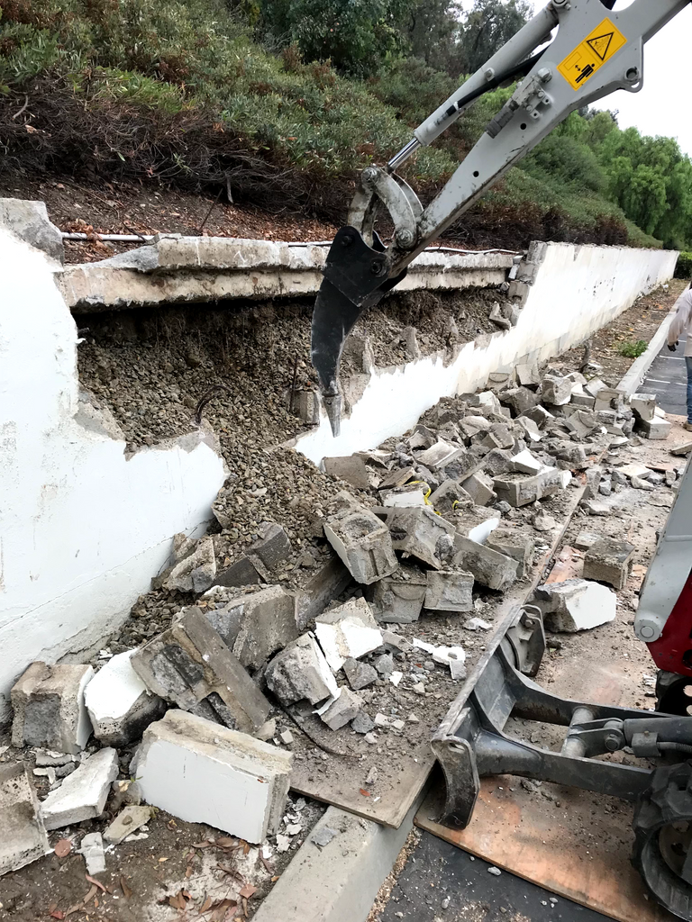 Close-up of concrete and drainage work on steep hillside